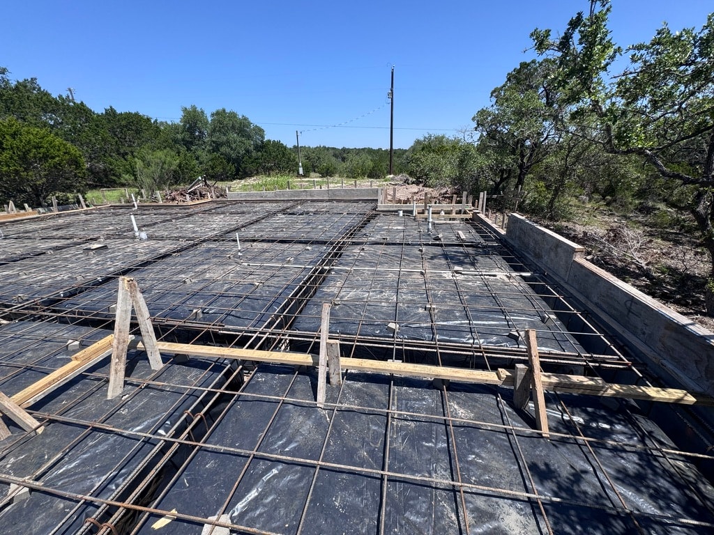 Concrete foundation rebar and slab preparation before pour
